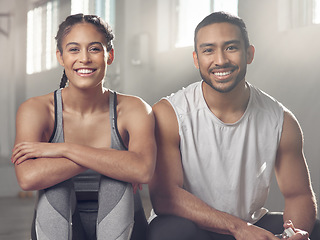 Image showing Theres something for everyone at the gym. two young athletes sitting together at the gym.