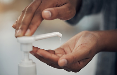 Image showing Kill the bacteria, break the cycle. an unrecognisable man disinfecting his hands with hand sanitiser.