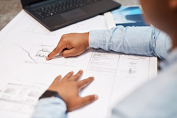 Image showing The finest talent in the architectural business. an unrecognisable architect drawing up a building plan in a modern office.