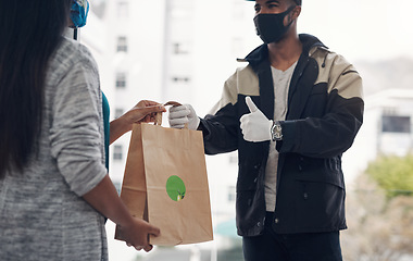 Image showing You dont need to go out to get great food. a masked young man showing thumbs up while delivery takeout to a customer at home.