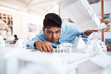 Image showing The better the quality, the higher the customer satisfaction. a young architect designing a building model in a modern office.