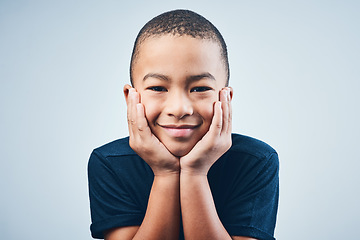 Image showing First rule of being a kid Smile. Studio shot of a cute little boy posing against a grey background.