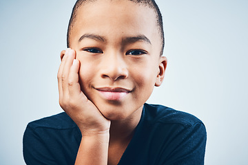 Image showing The face of pure innocence. Studio shot of a cute little boy posing against a grey background.