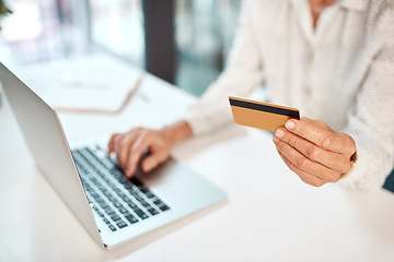 Image showing Transacting through her business banking profile. Closeup shot of an unrecognisable businesswoman using a laptop and credit card in an office.
