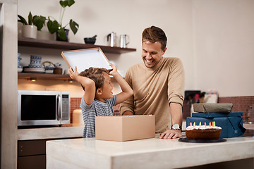 Image showing You got me just what I wanted. a man surprising his son with cake and gifts on his birthday.