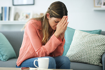 Image showing Dealing with lifes tests. a young woman looking upset while sitting at home.