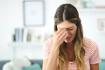 Image showing My emotions are all over the place right now. an attractive woman crying at home.