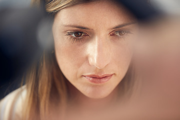 Image showing I cant help but wonder...an attractive woman looking thoughtful at home.