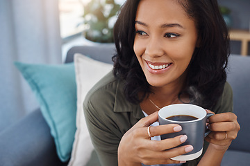 Image showing I really need to do more of this. an attractive young woman having coffee and relaxing on the sofa at home.