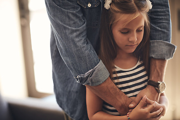 Image showing Love will keep the blues away. an adorable little girl looking sad and being comforted by her father at home.