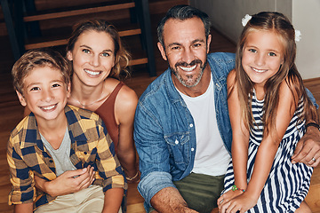 Image showing Home is a place where happiness lives. Portrait of a happy young family spending quality time at home.