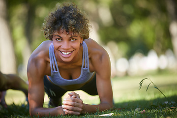 Image showing Strengthening the core. a beautiful young woman exercising outdoors.