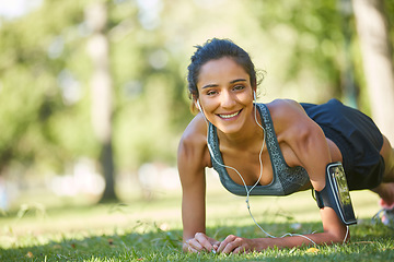 Image showing Im doing it for my health. a beautiful young woman exercising outdoors on a sunny day.