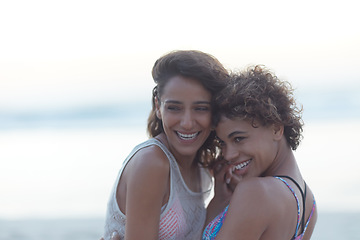 Image showing Together is a magical place. two young women enjoying themselves at the beach.