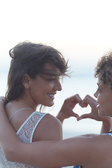 Image showing Love is whatever you want it to be. two young women enjoying themselves at the beach.