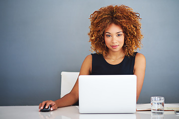 Image showing Shes the best when it comes to business. a young businesswoman working on her laptop.