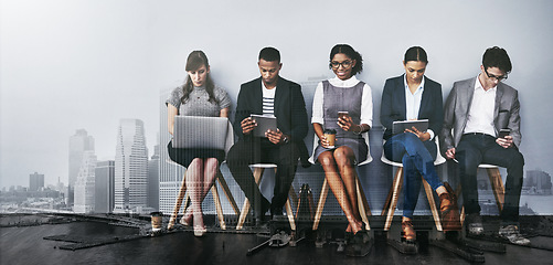 Image showing These seats are for those on the shortlist. Full length shot of a group of young businesspeople waiting in line for their interviews.