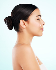 Image showing Profiling beauty. Studio shot of an attractive young woman posing against a light background.