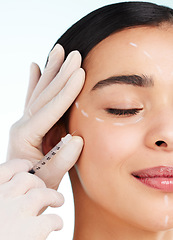 Image showing No imperfections allowed. Studio shot of an attractive young woman having some plastic surgery done against a light background.