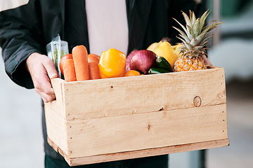 Image showing As fresh as it would be from your garden. a man delivering fresh fruit and vegetables to a place of residence.