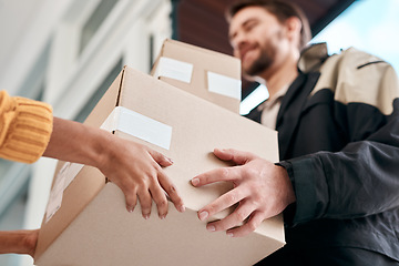 Image showing Take care not to touch. a young man delivery a package to a woman at home.