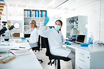 Image showing Doing multiple tests until she reaches a perfect outcome. a scientist analysing samples in a lab with her colleague in the background.