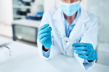 Image showing A swab is needed for further testing. Closeup shot of an unrecognisable scientist holding a sampling swab and test tube in a lab.