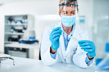 Image showing We can make a more accurate diagnosis based off your DNA. a scientist holding a sampling swab and test tube in a lab.