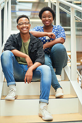 Image showing To get to the top youll have to get past us. Portrait of a young businessman and businesswoman sitting on the steps of a modern office.