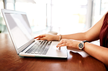 Image showing Success only happens once you work for it. Closeup shot of an unrecognisable businesswoman using a laptop in an office.