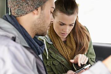 Image showing Checking the map. a young couple on a roadtrip.