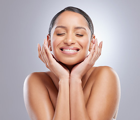 Image showing Loving my skin. an attractive young woman standing alone in the studio and posing.