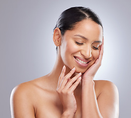 Image showing My self-care routine shows in my skin. an attractive young woman standing alone in the studio and posing.