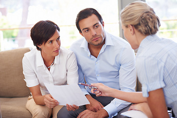 Image showing Laying out different investment options. a financial advisor explaining documents to a couple.