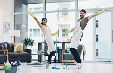 Image showing Putting a twist on those daily household tasks. a happy young couple having fun while mopping the floor at home.