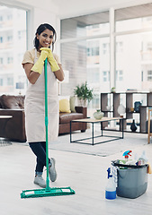 Image showing Nothing says welcome home like a clean house. a young woman cleaning her home.