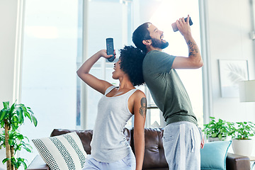 Image showing Were super comfortable around each other. a couple having a sing along at home.