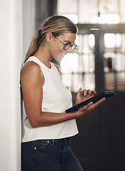 Image showing Increased portability, increased productivity. a young businesswoman using a digital tablet in a modern office.