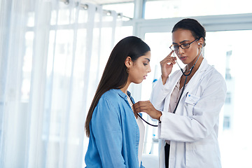 Image showing Im picking up some congestion. a young doctor examining her patient with a stethoscope.