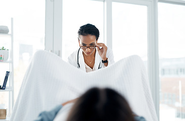 Image showing You look healthy to me. a female doctor giving a patient a gynecological checkup.