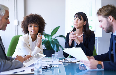 Image showing Getting the job done with teamwork. a group of business colleagues meeting in the boardroom.