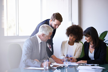 Image showing Getting the job done with teamwork. a group of business colleagues meeting in the boardroom.