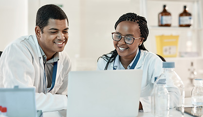 Image showing Making new discoveries as a team. two scientists working together on a laptop in a lab.