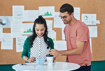 Image showing Their new product is nearly ready to launch. a young businessman and businesswoman having a meeting in a modern office.