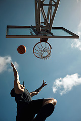 Image showing Its all about agility. a sporty young man playing basketball on a sports court.