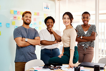 Image showing Allow us to wow you with new and amazing ideas. Portrait of a group of young creatives standing together in an office.