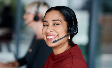 Image showing Its about building a relationship with the customer. Portrait of a young businesswoman wearing a headset while working in an office.