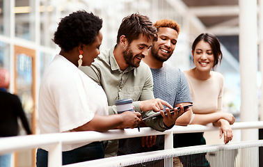 Image showing Pushing the boundaries to reach greatness together. a group of young creatives using a digital tablet together in an office.