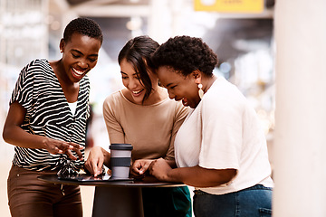 Image showing Developing ideas in a creative work atmosphere. a group of businesswomen using a digital tablet together in an office.