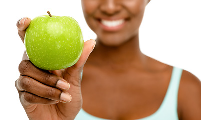 Image showing Healthy eating, happy life. Studio shot of an unrecognisable woman eating a green apple against a studio background.